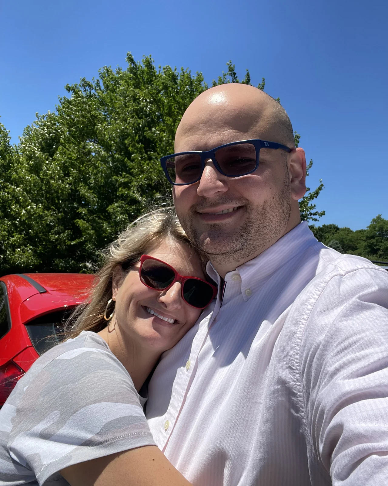 Joe and Tara smiling together outdoors